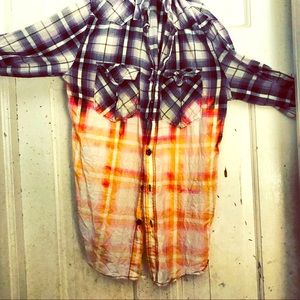 A bleached out Flannel from the chest down.